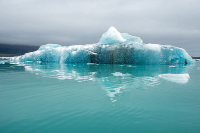 Floating icebergs in jokulsarlon glacial lagoon, iceland. global warming