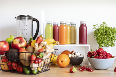 Close-up of food in bottles on white background