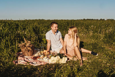 Young couple standing in field