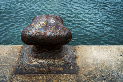 High angle view of rusty pier over sea