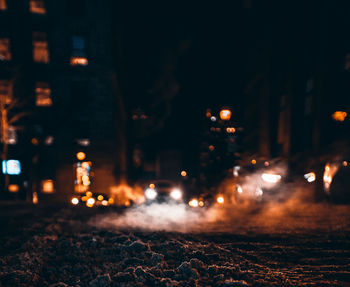 Defocused image of illuminated city at night