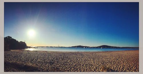 Scenic view of beach against clear sky