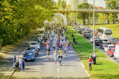 People on road in city