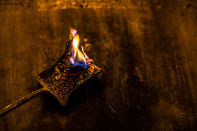 Close-up of burning candle