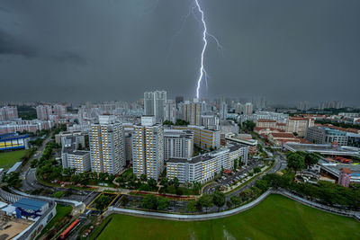 Aerial view of city against sky at night