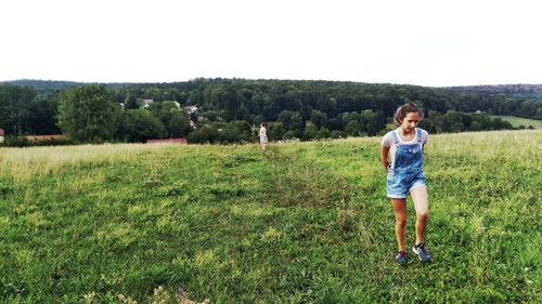 Full length of man standing on field