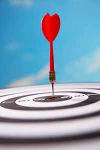 Low angle view of dartboard against sky