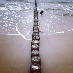 High angle view of surf on beach