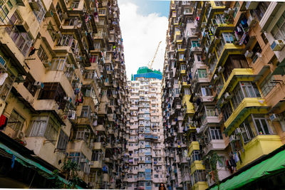 Low angle view of buildings in city against sky