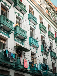 Low angle view of clothes drying on building