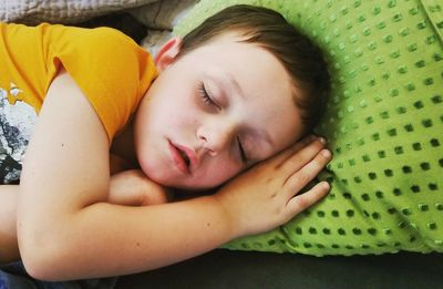 Portrait of girl sleeping on bed