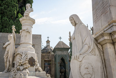 Low angle view of statue against sky