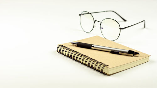 High angle view of pen on table against white background