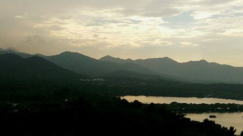 Scenic view of mountains against sky during sunset