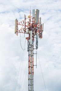 Low angle view of communications tower against sky