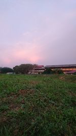 Scenic view of field against sky during sunset