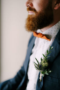 Side view of man holding plant