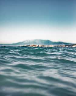 Surface level of sea against clear sky