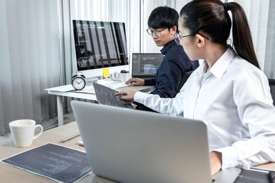 Businesswoman working at desk in office