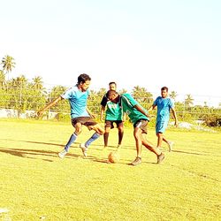 People on field against sky