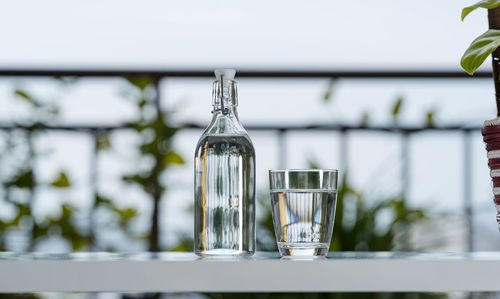 Close-up of glass bottle on table