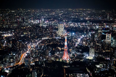 Aerial view of illuminated tokyo tower in city at night