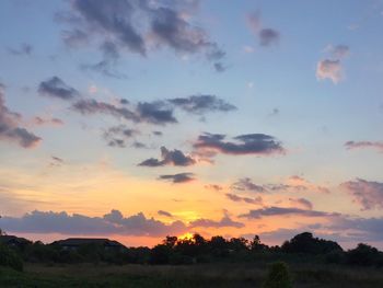 Scenic view of landscape against cloudy sky