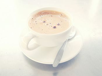 Close-up of coffee cup on table