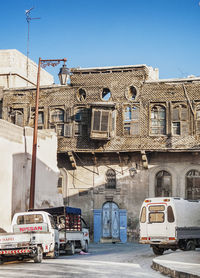 Cars on street against buildings in city