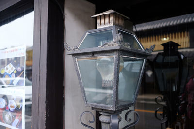 Close-up of glass window of store