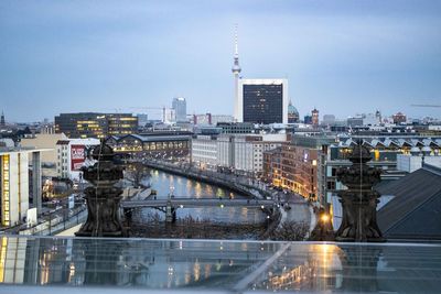 View of bridge over river in city