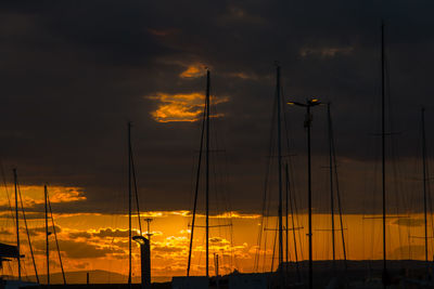 Silhouette of sailboats at sunset