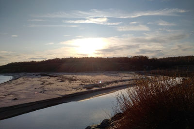 Scenic view of lake against sky during sunset