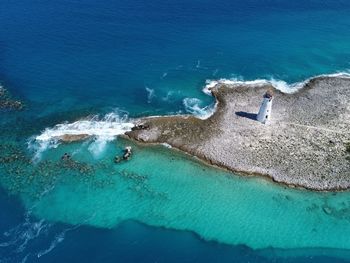 High angle view of lighthouse by sea