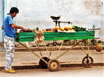 Side view of man working with food