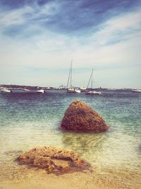Scenic view of sea against cloudy sky