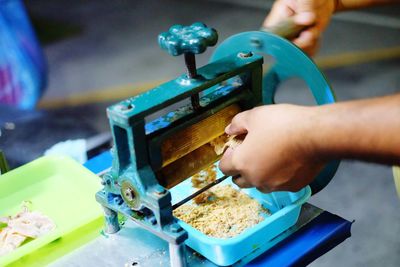 Cropped hands of man preparing food