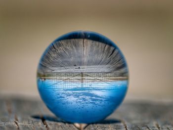 Close-up of crystal ball on glass