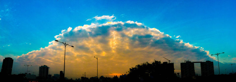 Low angle view of silhouette buildings against sky during sunset