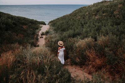 Full length of boy standing on beach