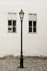 Old street light against building