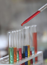 Close-up of chemical being poured in test tube at laboratory