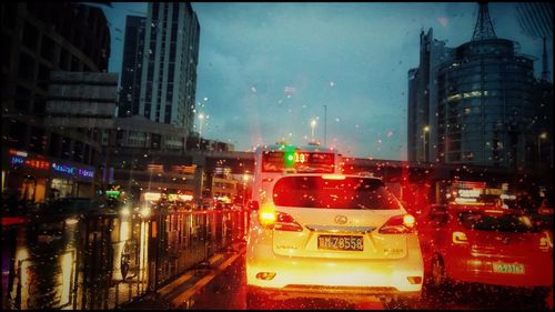 Traffic on city street during rainy season