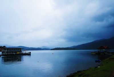 Scenic view of lake against cloudy sky