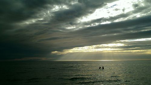 Scenic view of sea against cloudy sky