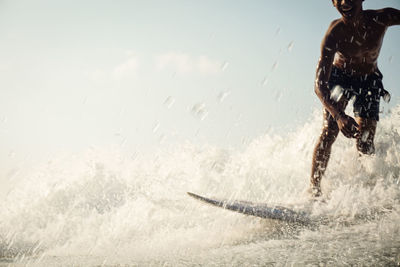 Man splashing water in sea