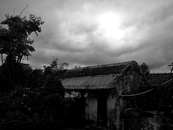 House on field against sky