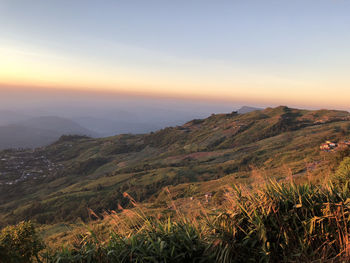 Scenic view of landscape against sky during sunset