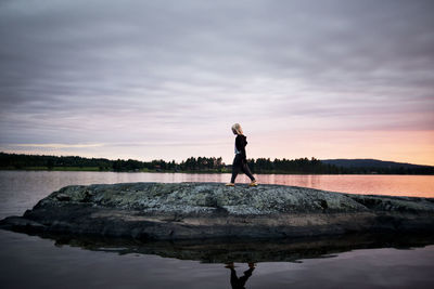 Girl walking at sunset, siljan, dalarna, sweden