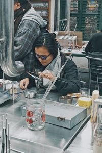 Man working on glass table